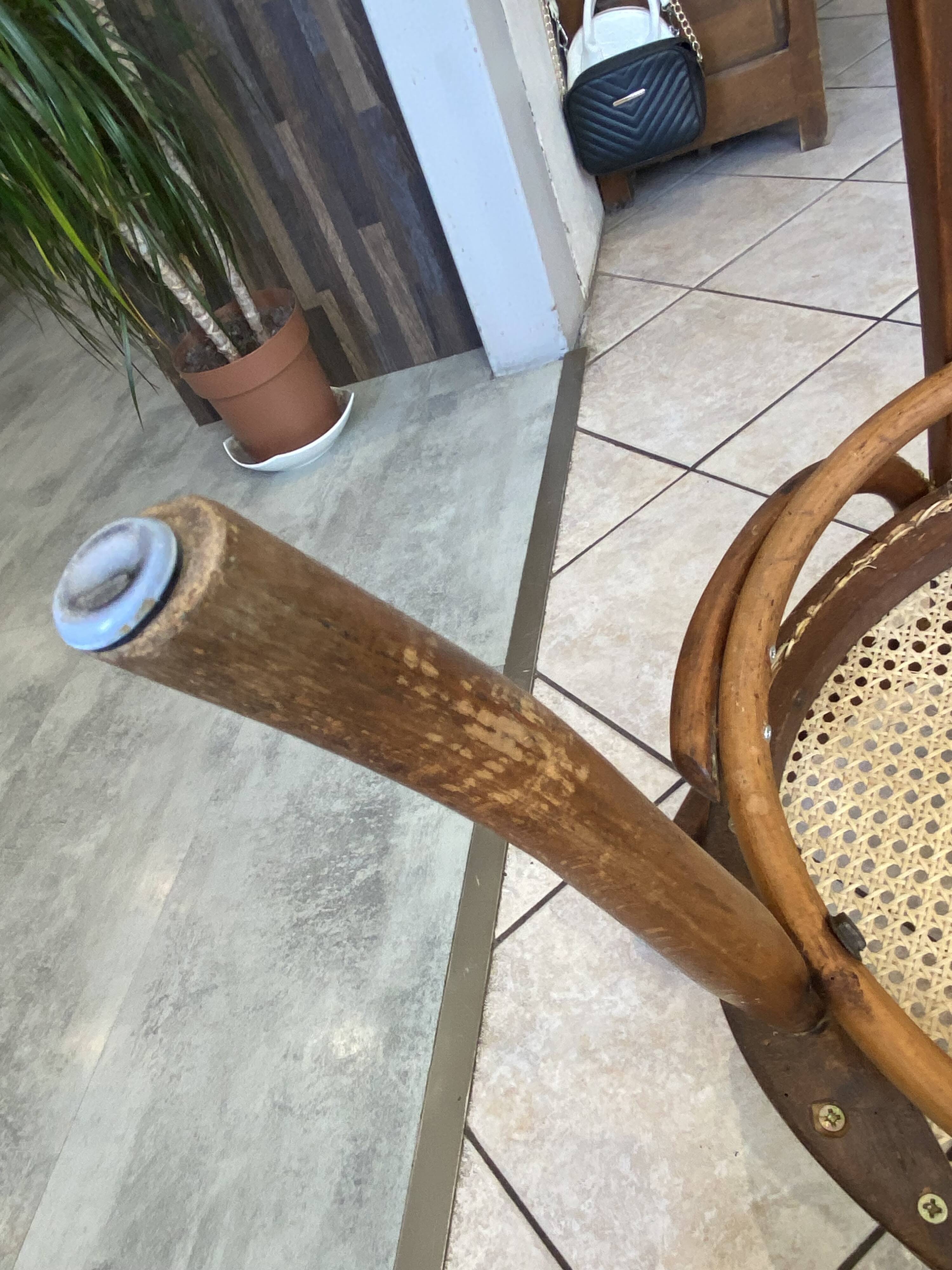 Bistro chair with a curved wooden frame and caned seat from the 1930s.
