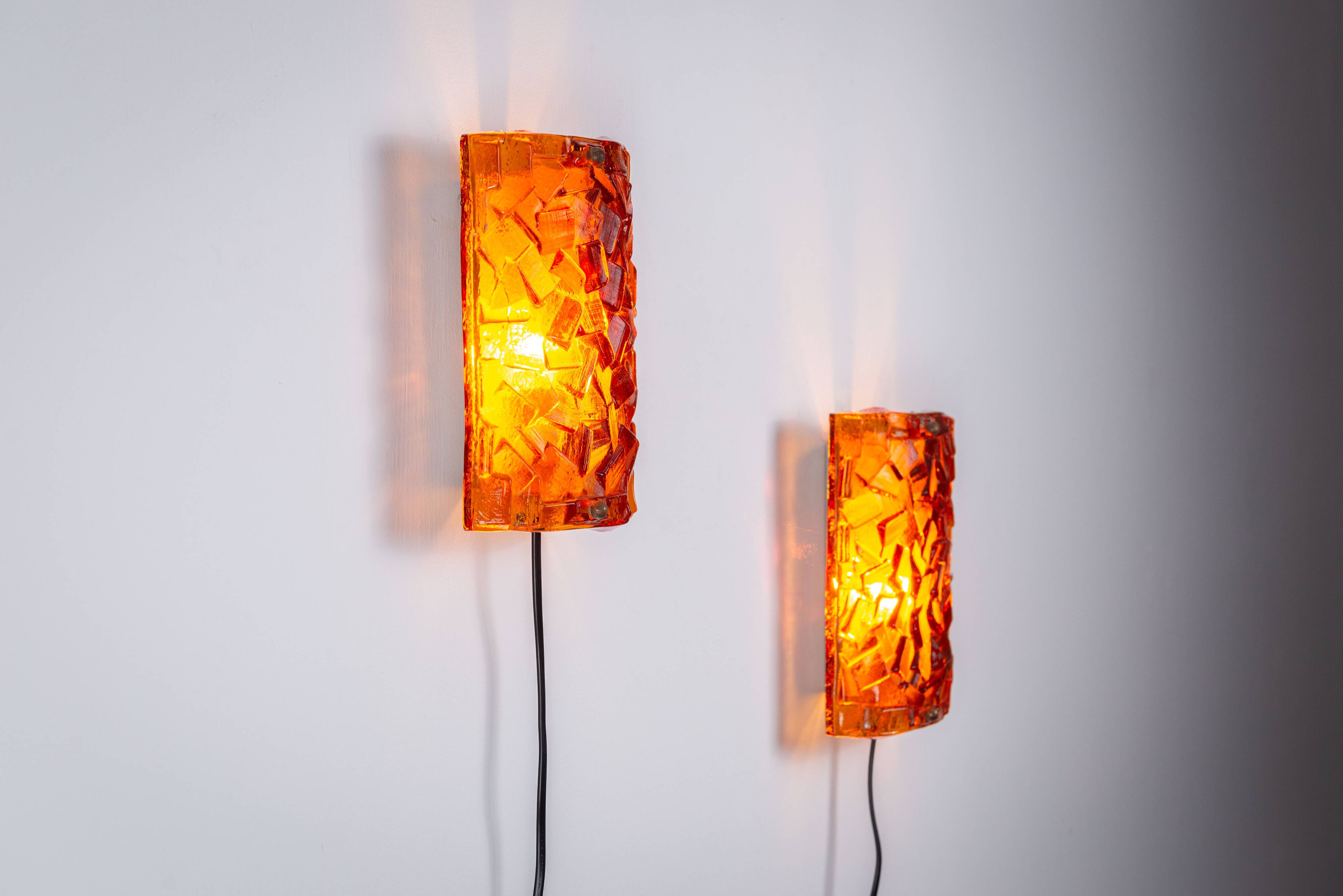 Vitrika Nybro amber coloured wall lamps