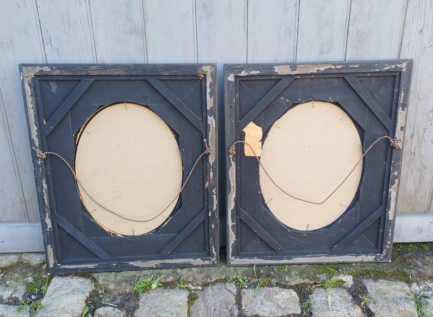 Pair of antique mirrors from the Napoléon III period, black and gilded.
