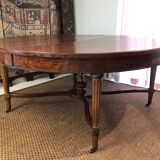 Important central pedestal table in mahogany, brass and bronze that can form a large dining table.