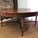 Important central pedestal table in mahogany, brass and bronze that can form a large dining table.