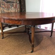 Important central pedestal table in mahogany, brass and bronze that can form a large dining table.