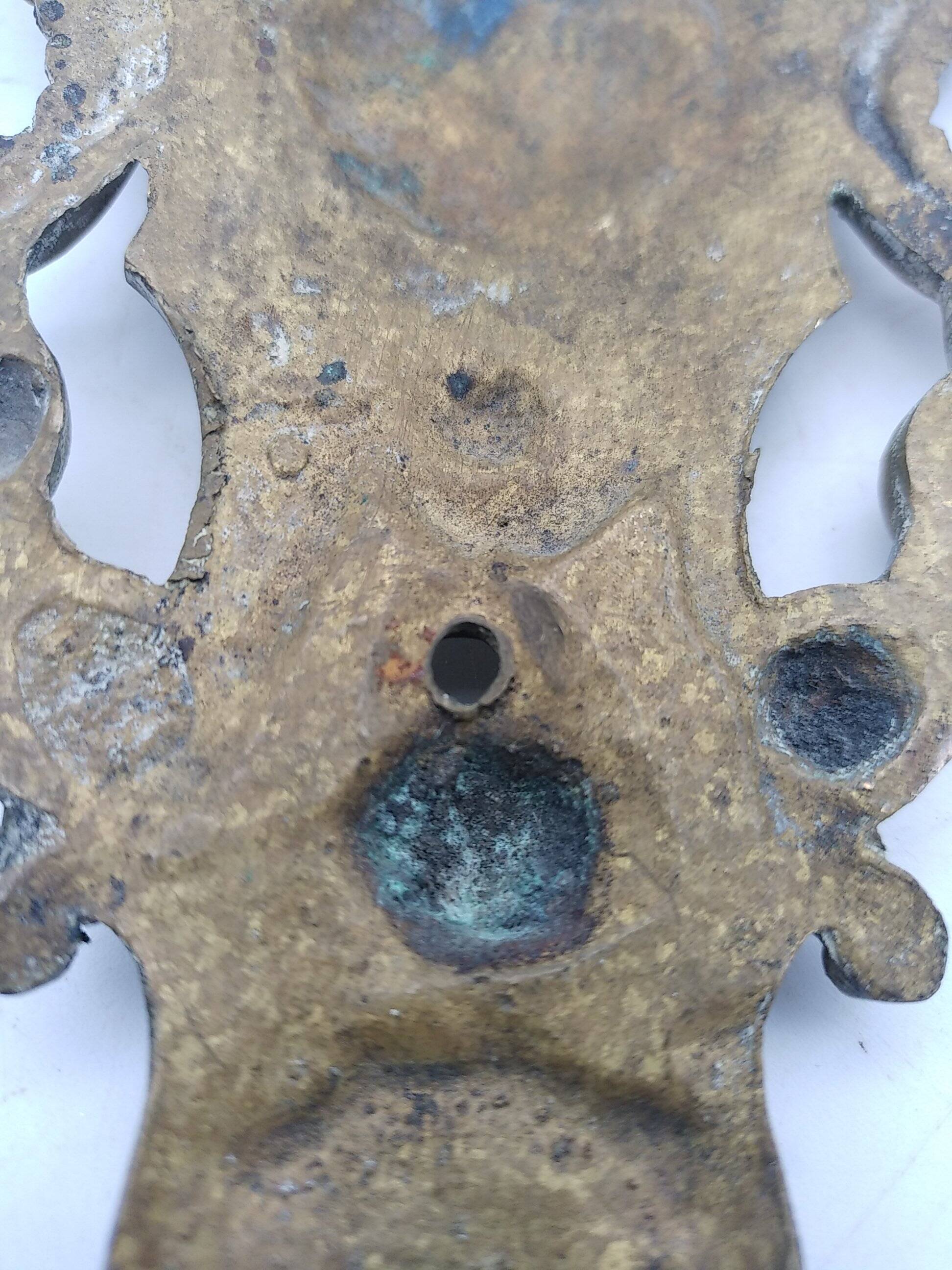 Brass lion head. Furniture decoration, leftover knocker or large nail cover?