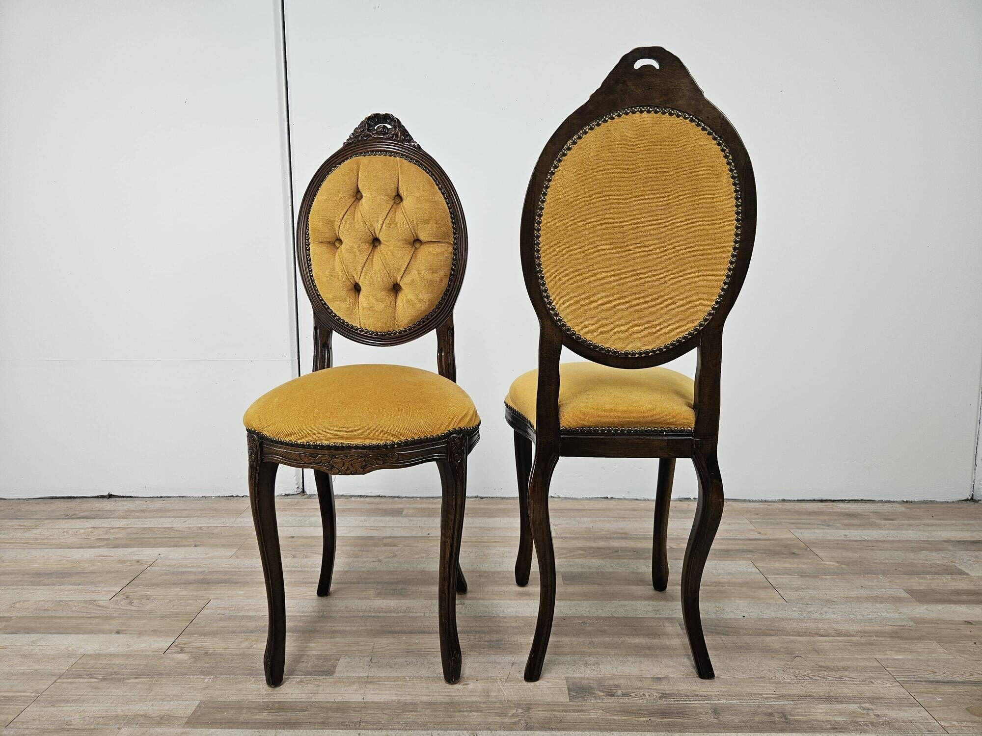 Pair of early 1900s wooden chairs with padded seat and backrests