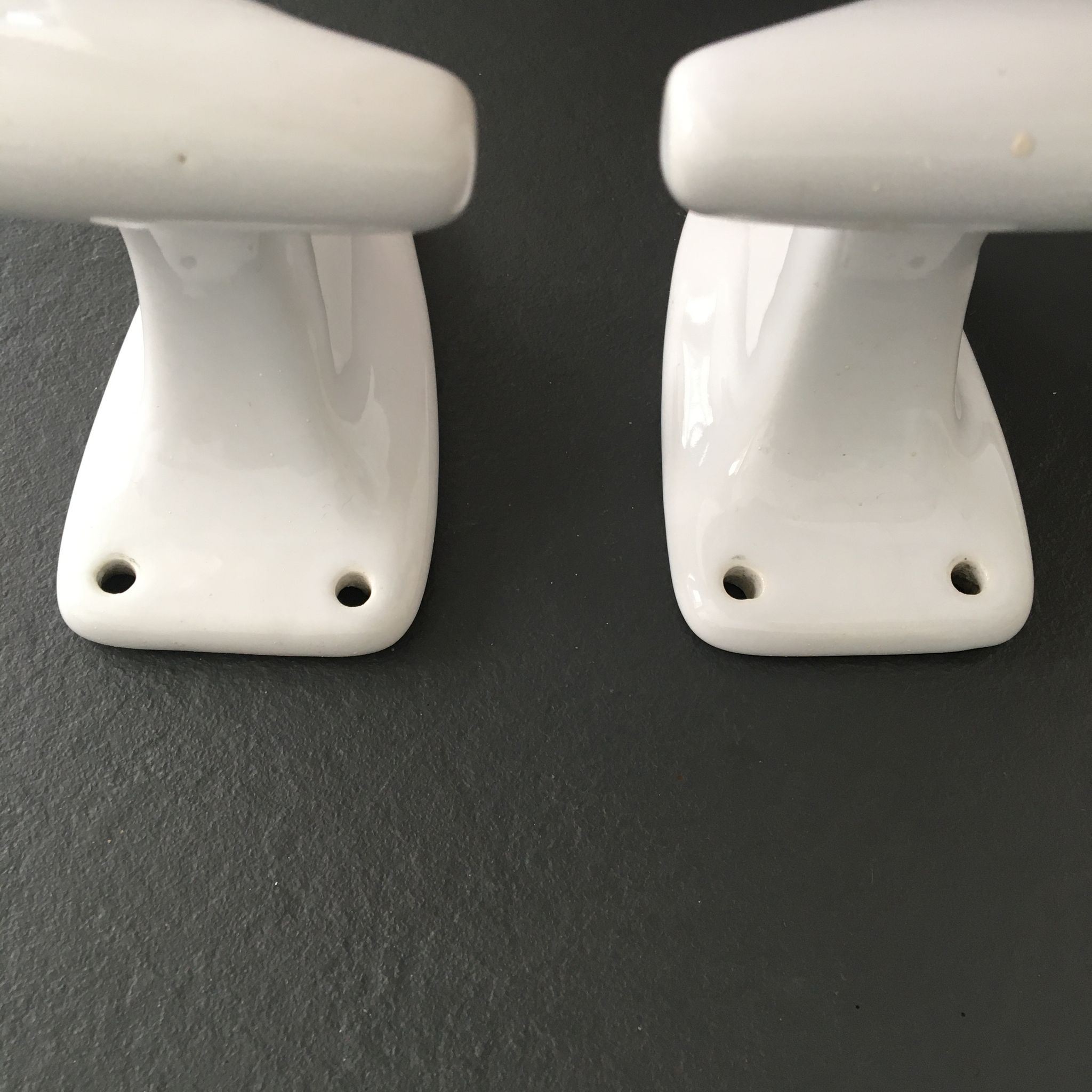 Pair of retro white porcelain hooks