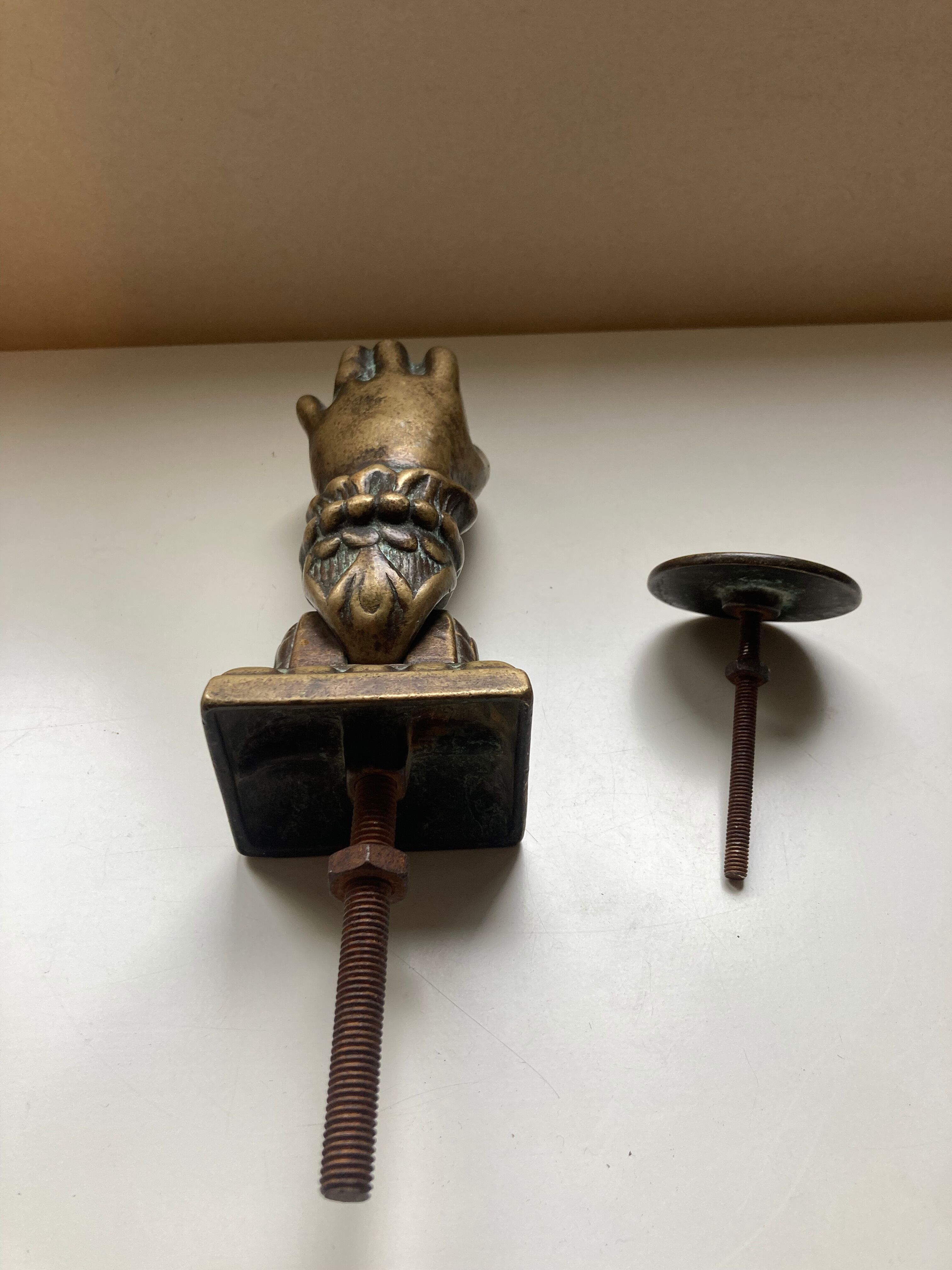 Antique bronze hand-shaped door knocker