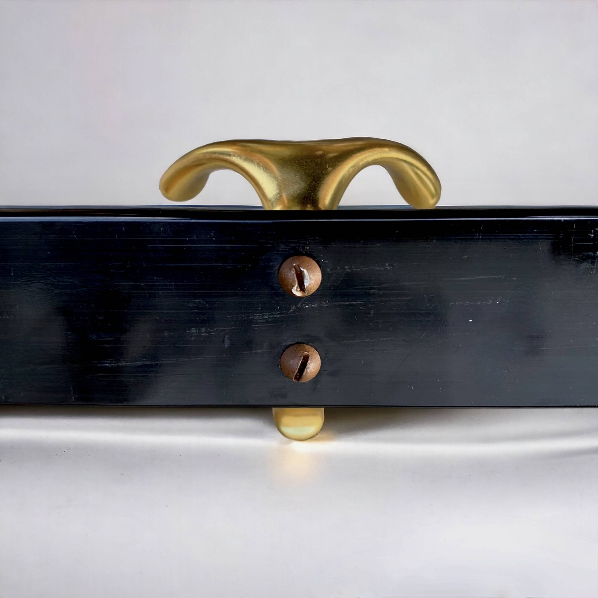 Vintage coat rack in lacquered metal with three golden aluminum hooks