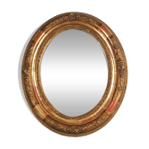 Antique oval mirror with original stucco and gilt wood frame, 37x31 cm. Beautiful patina.