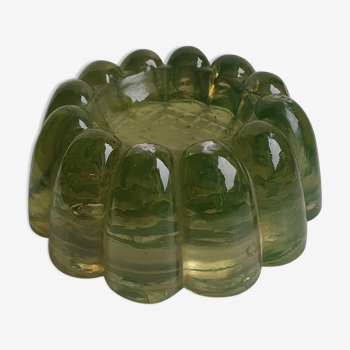 Antique candle holder in khaki tinted glass