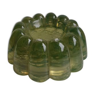 Antique candle holder in khaki tinted glass