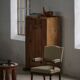 Modern Danish armchair in turned wood with floral fabric, early 20th century.