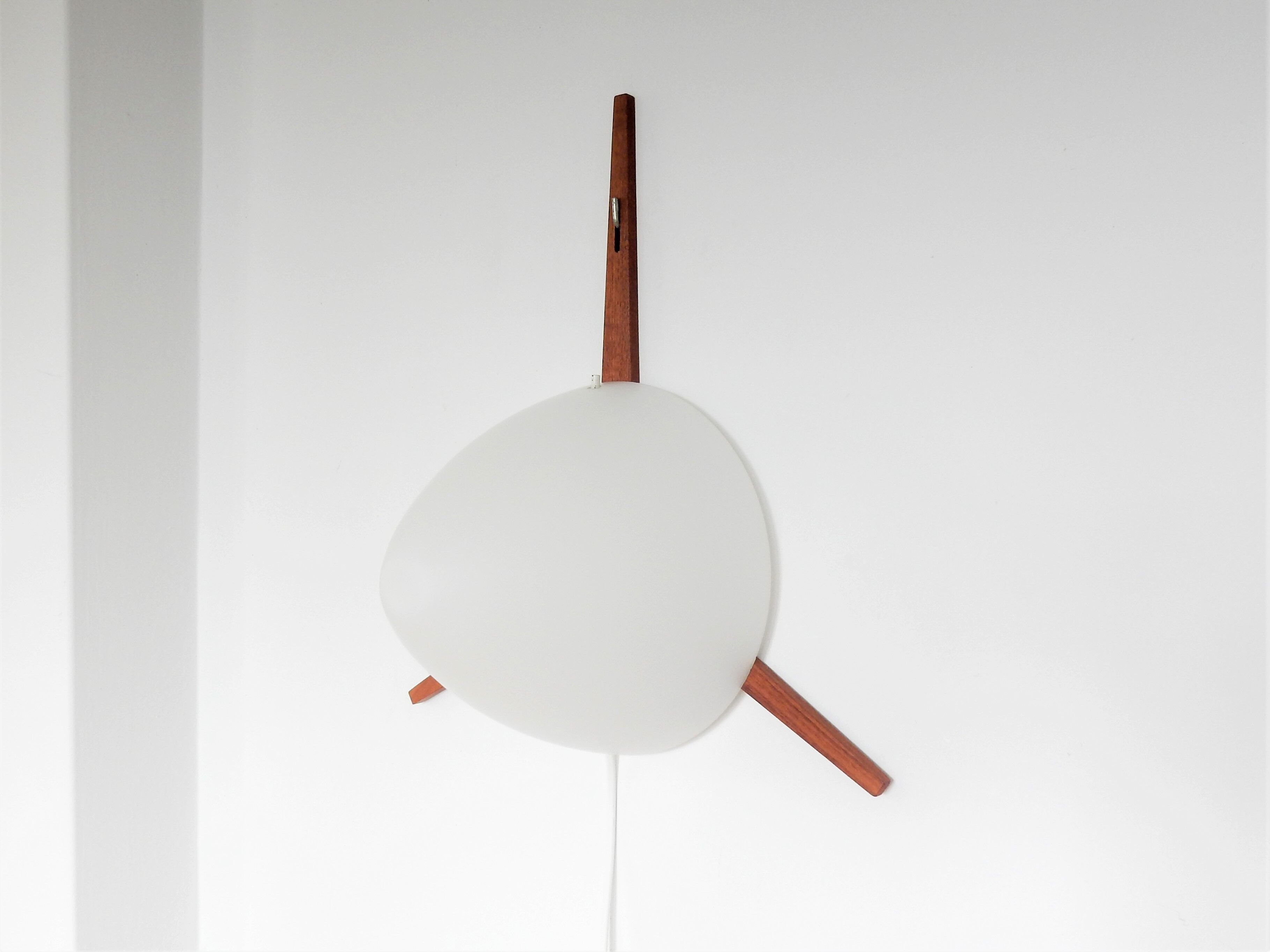 C-1575 teak and opaline glass wall lamp by Eje Ahlgren for Raak 1957
