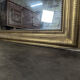 Golden wooden mirror with antique frieze from the Louis Philippe period.