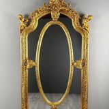 Grand miroir style Louis XV en bois sculpté et doré, XIXe siècle