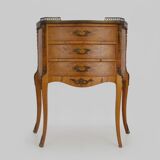 Baroque style wooden chest of drawers with bronze frieze.