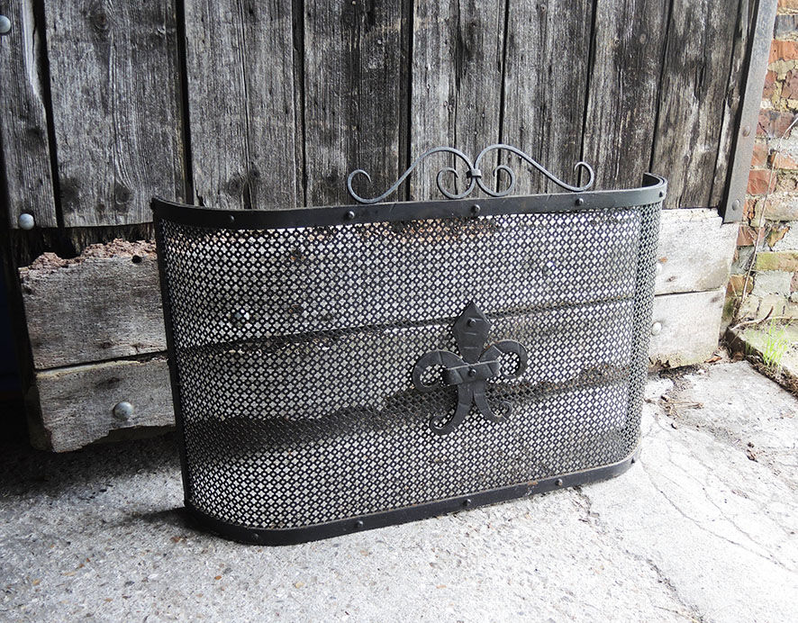 Old fire shield for fireplace fleur de lys