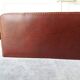 Letter holder covered in leather and golden metal by roche design