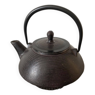 Brown cast iron teapot with filter