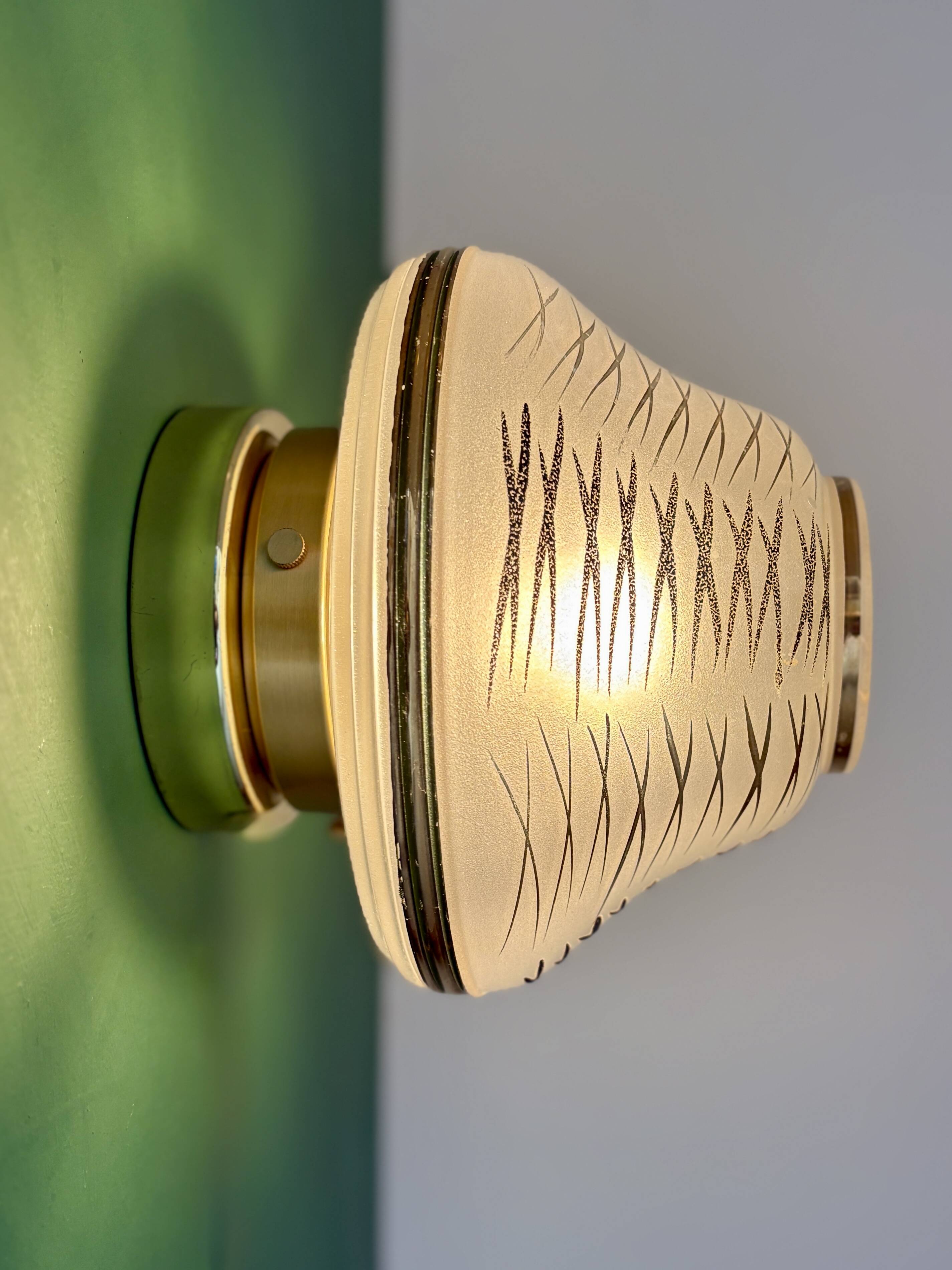 Vintage Art Deco globe wall/ceiling light in white, black, and gold glass.