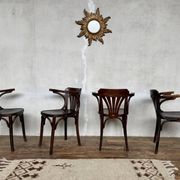 Série de 4 fauteuils vintage en bois courbé – Élégance intemporelle