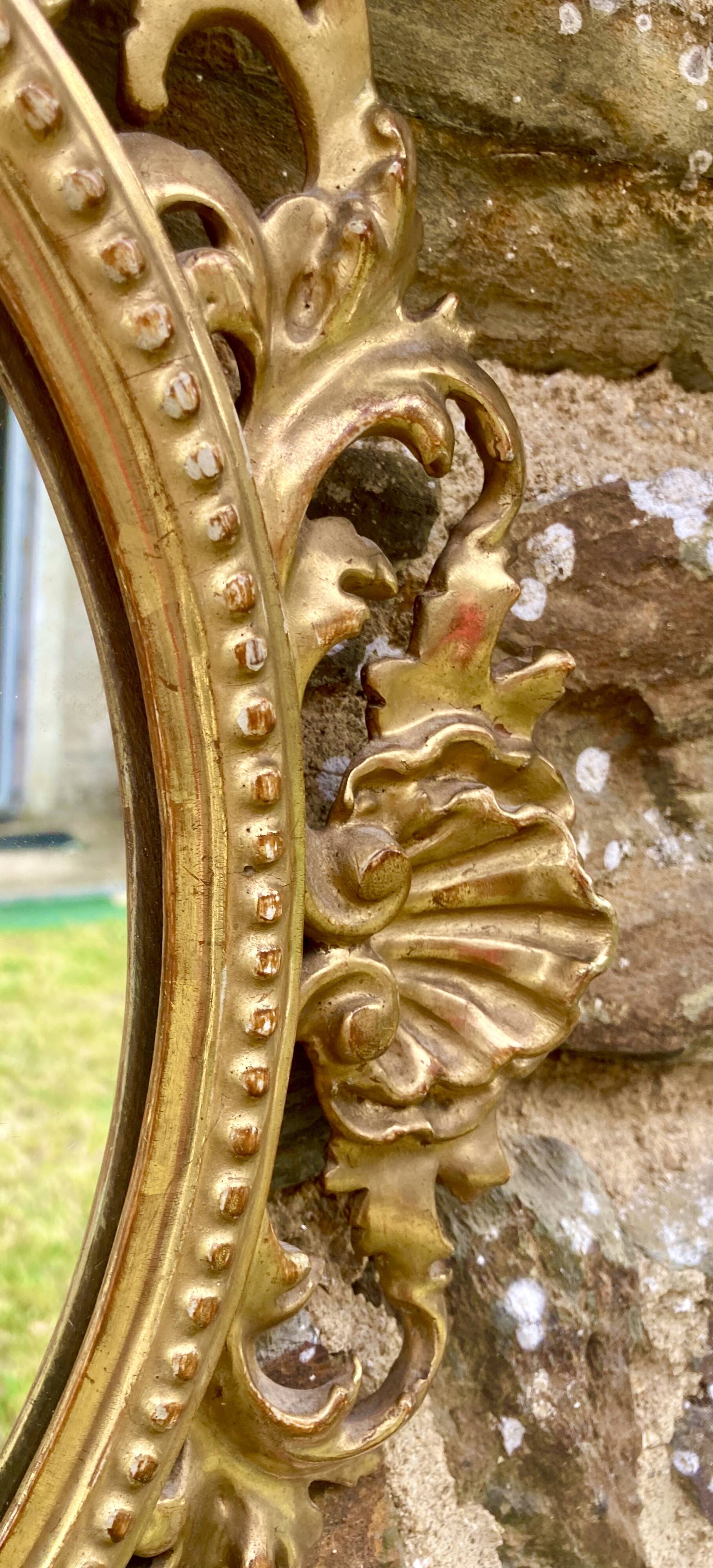 Mirror in carved wood gilded with leaf, Louis XV period, 18th century