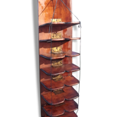 Industrial wall panel in walnut has 8 folding shelves