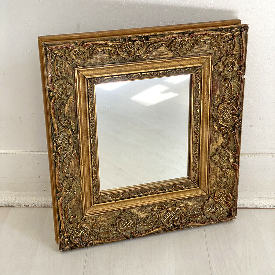 Small old mirror in gilded wood