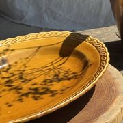 Antique oval dish, yellow-orange, frieze border L:24