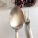 Set of 2 silver metal cutlery with punches