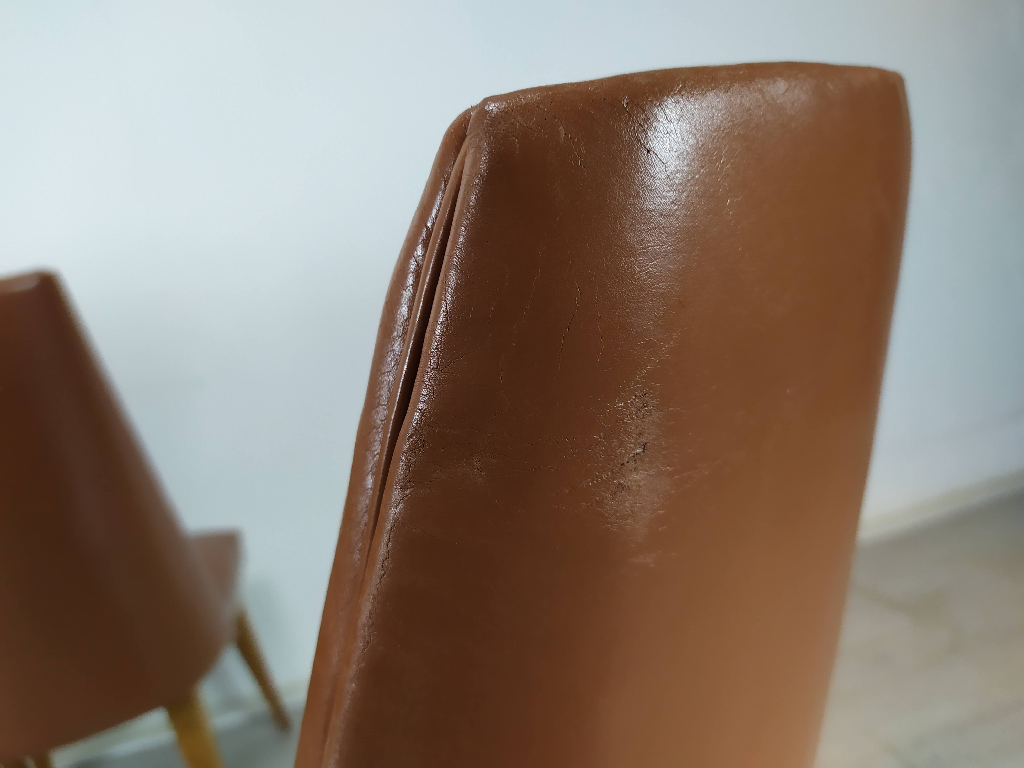 8 brown skai chairs 1950