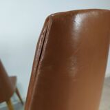 8 brown skai chairs 1950