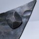 Brutalist metal pocket with patinated tripod