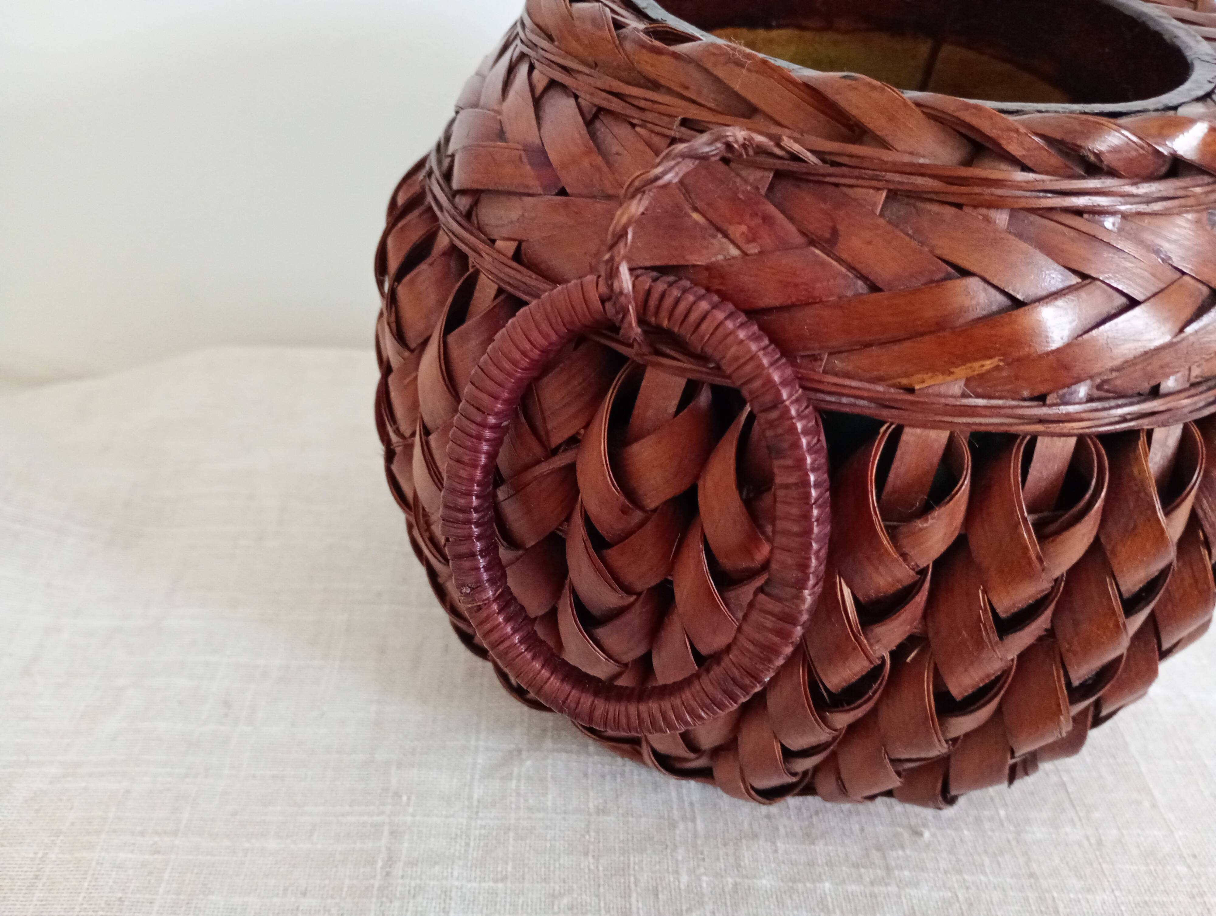 Japanese vase made of woven bamboo. Ikebana.