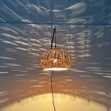 Mid-century modern Danish extendable cantilever wall lamp with a rattan shade, 1960s.