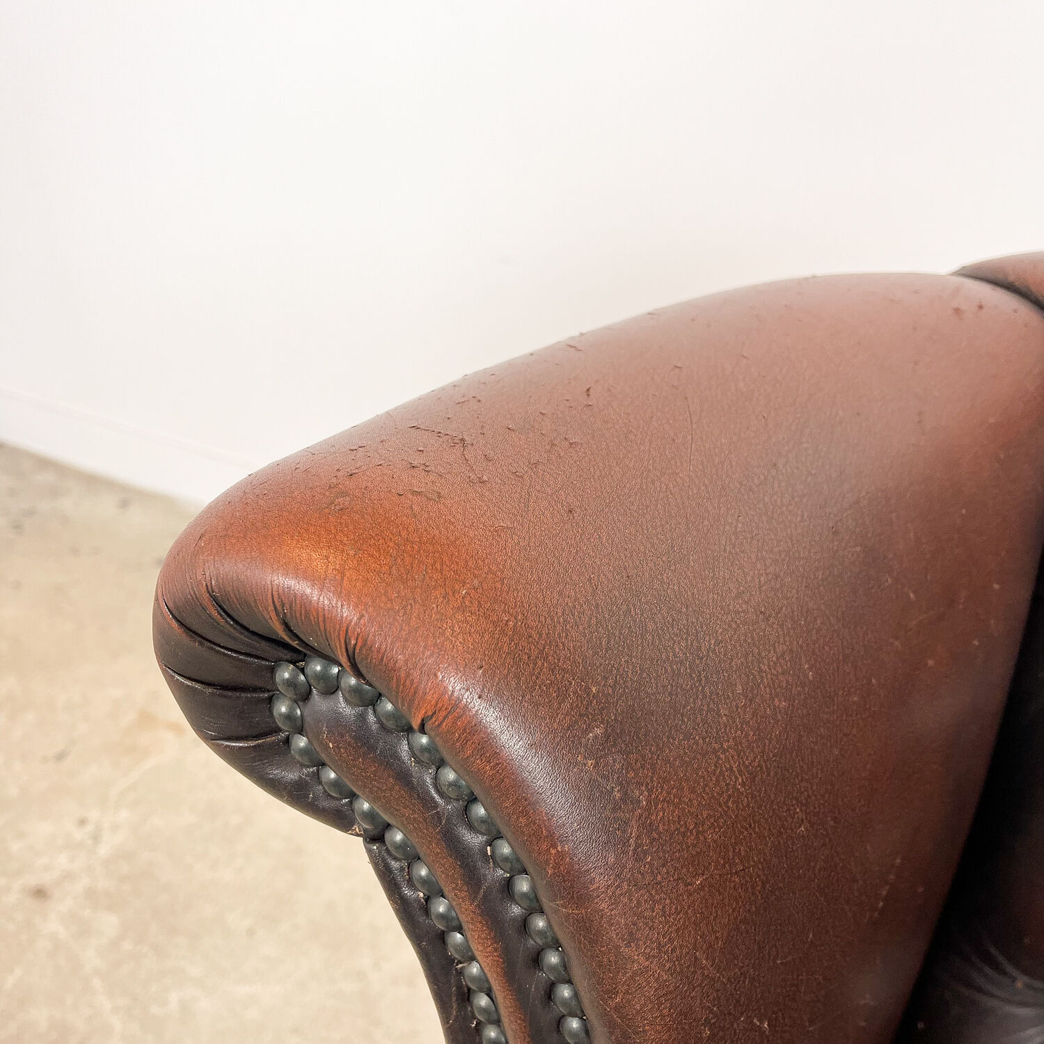 Vintage rustic dark brown leather chesterfield wingback armchair wassenaar