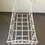 White wrought iron folding bed