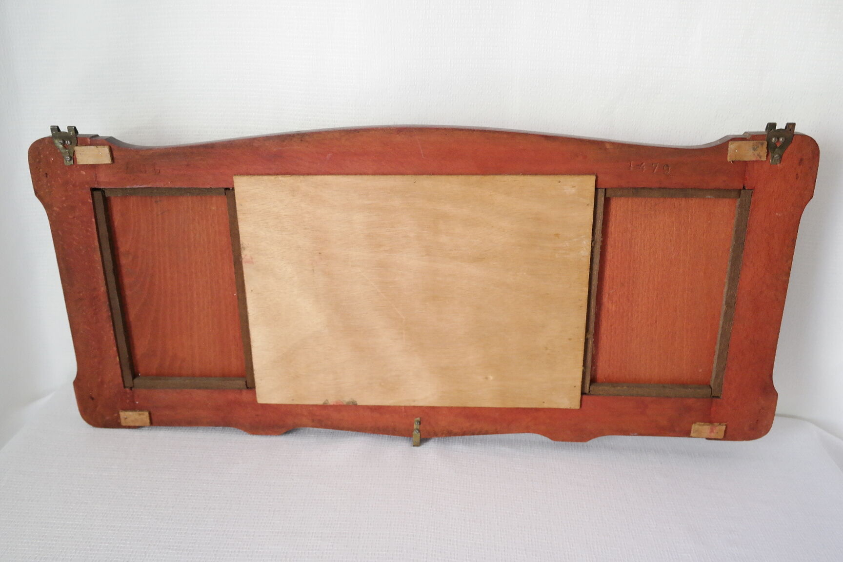 Red wooden wall-mounted coat rack and Art Deco mirror