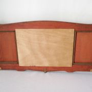 Red wooden wall-mounted coat rack and Art Deco mirror