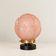 Penelope — Art Deco table lamp in sculpted pink glass, black brass base.