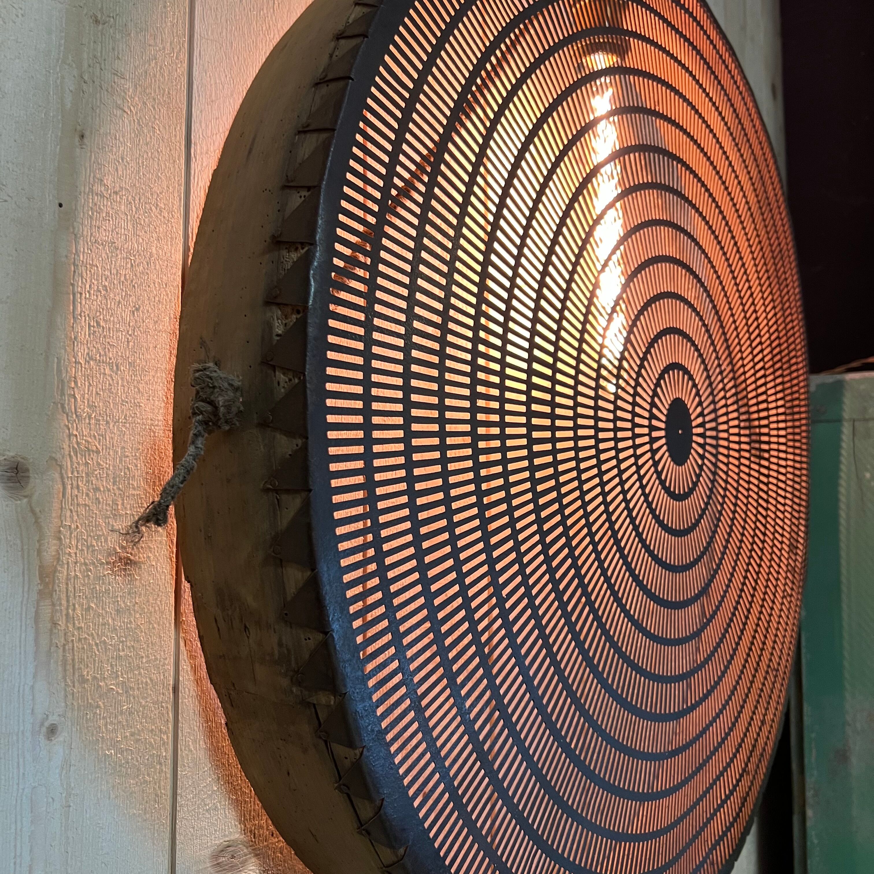 Old lamp in wood and metal worked with integrated lamp.