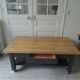 Coffee table on casters, 1 drawer, 1 shelf, re-enchanted in slate gray, wooden top.