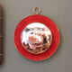 Witch's eye mirror in brass and red velvet