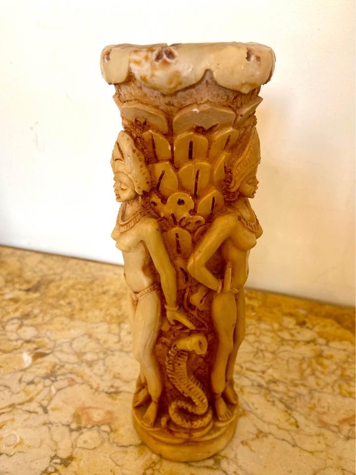 Two ancient Indonesian candlesticks.