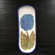 Hortensia-decorated stoneware plate signed