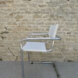 Armchair in chrome and leather