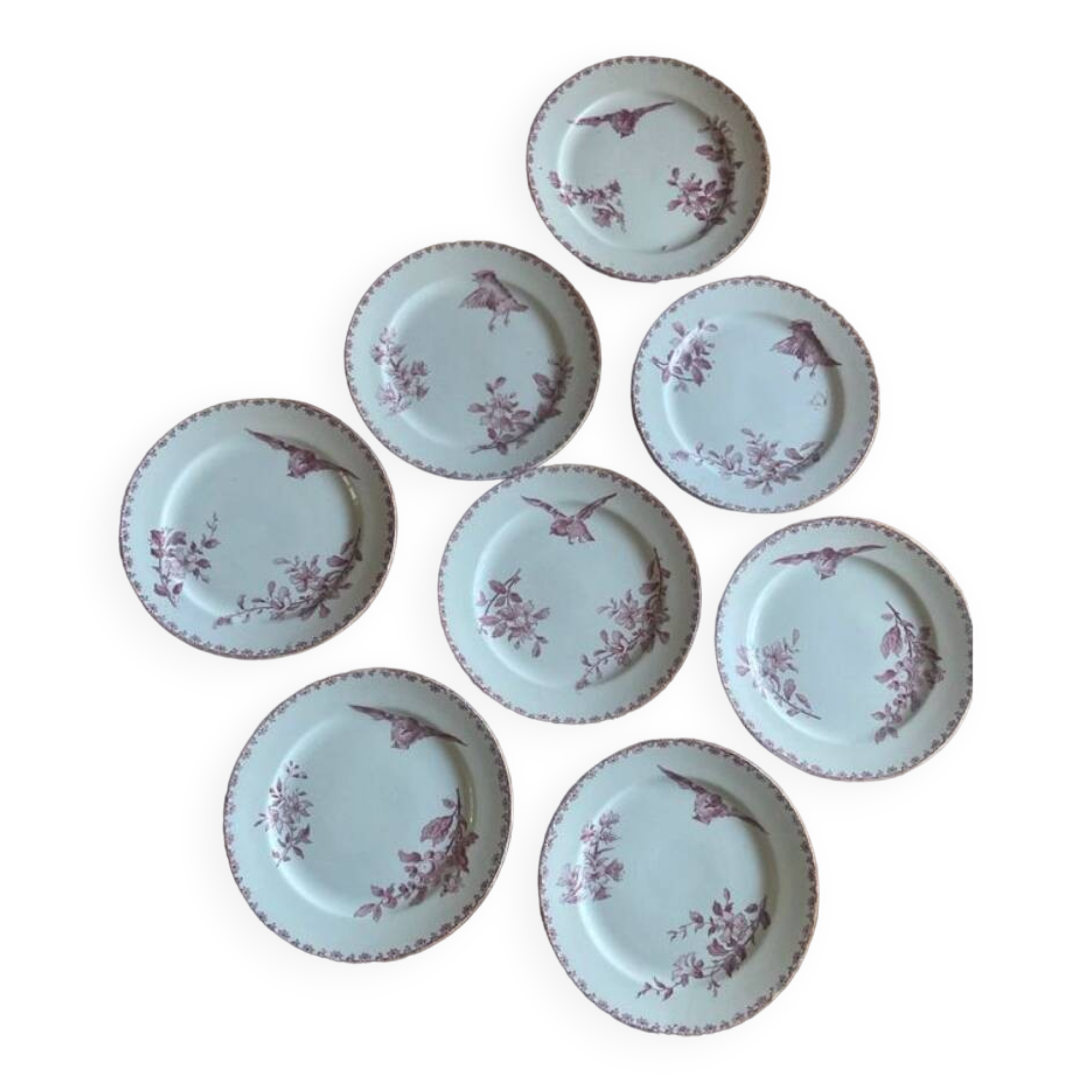 A series of eight flat plates in Terre de fer earthenware, Favori aux oiseaux model - pink tint