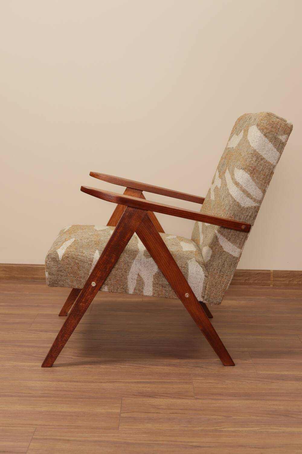 Pair of vintage lounge chairs in brown jacquard fabric and wood.