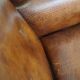Sheepskin leather wingback armchair, with nails and black piping