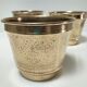 Three pot covers brass silver cover golden patina monogram early twentieth century