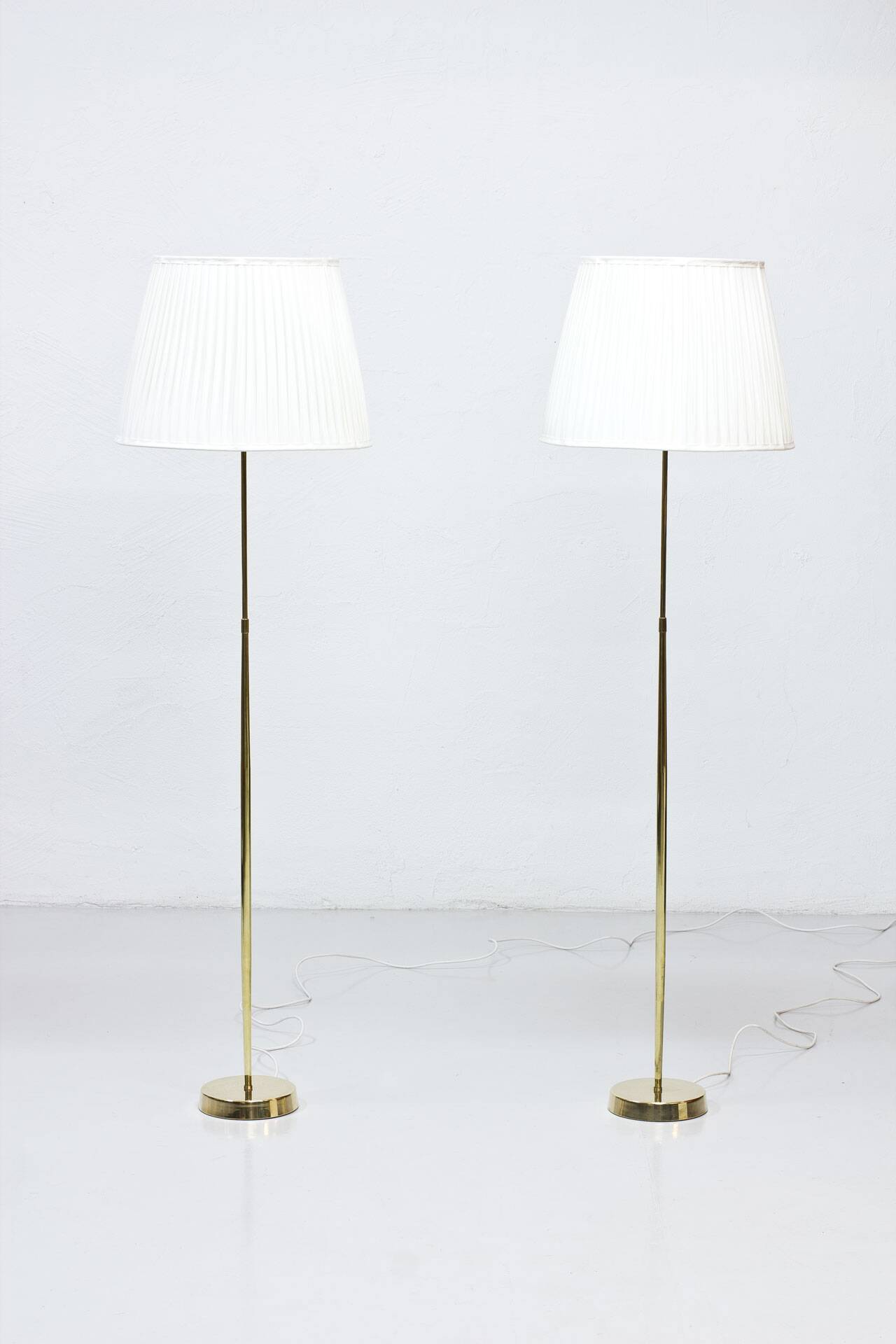 Pair of brass floor lamps by ASEA Belysning, Sweden, 1950s